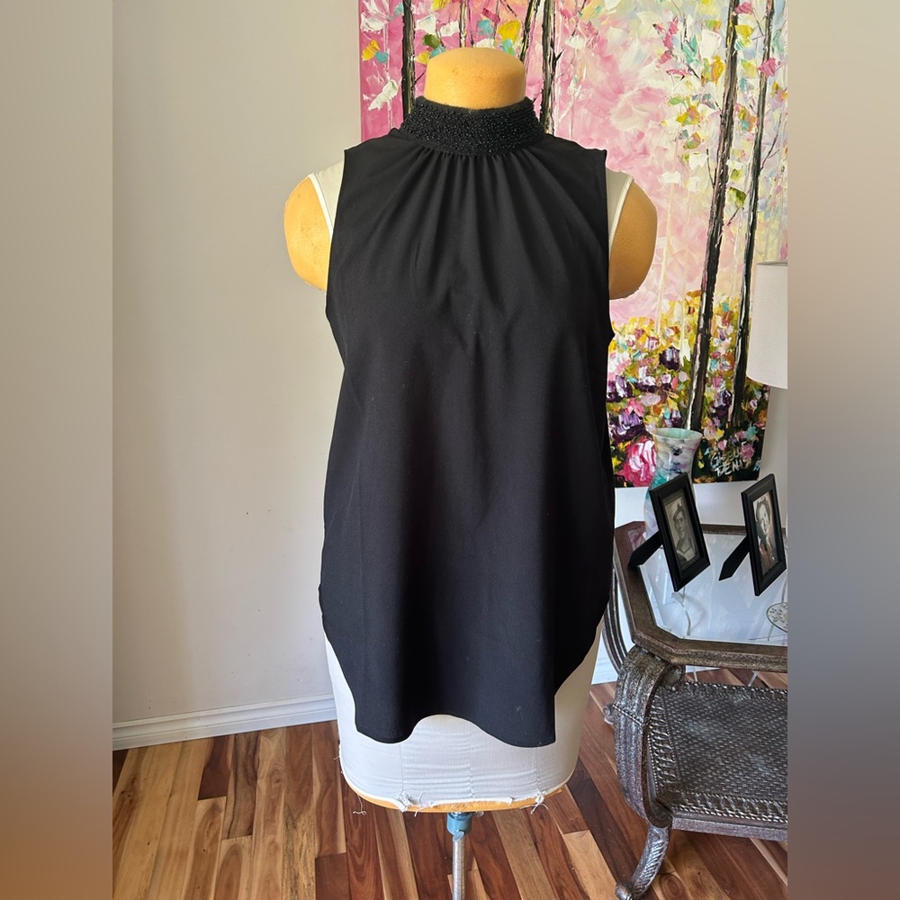 Ladies sleeveless shirt. Sequin/stones on  neck. Banana Republic. EUC! Sz M